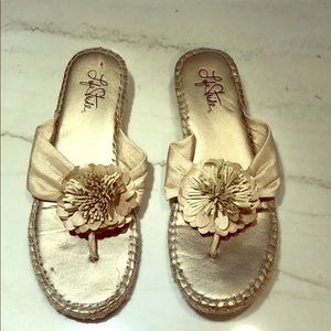 Soft gold flip flips w/ flower, natural woven heel